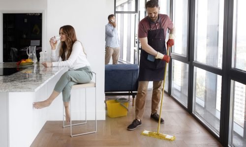 man-servant-cleaning-house Airbnb & Vacation Rental Cleaning