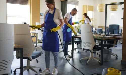 professional-cleaning-service-person-using-vacuum-cleaner-office Office Cleaning